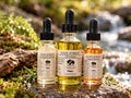 GLOW facial care gift bundle: Tone & Glow, Cool Forest Oil Cleanser and Sea Buckthorn facial oil in a moss and water setting
