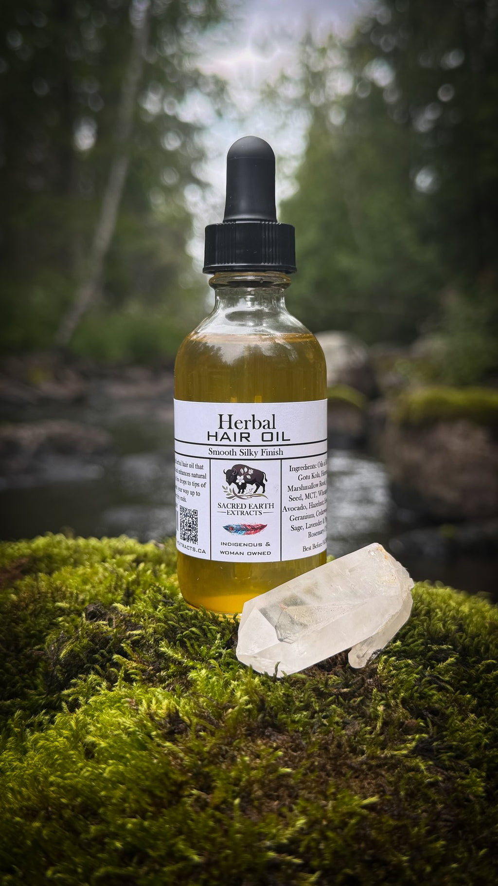 Herbal Hair Oil bottle on moss