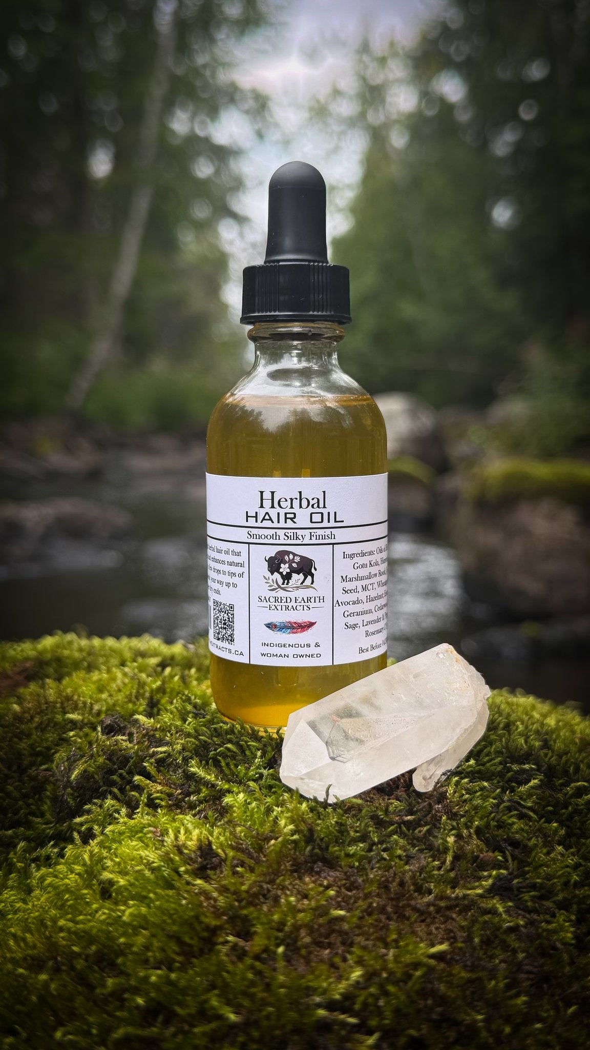 Herbal Hair Oil bottle on moss