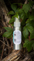 Bug Off outdoors spray bottle among leaves
