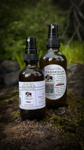 Dead Sea Magnesium spray in two sizes on a mossy rock