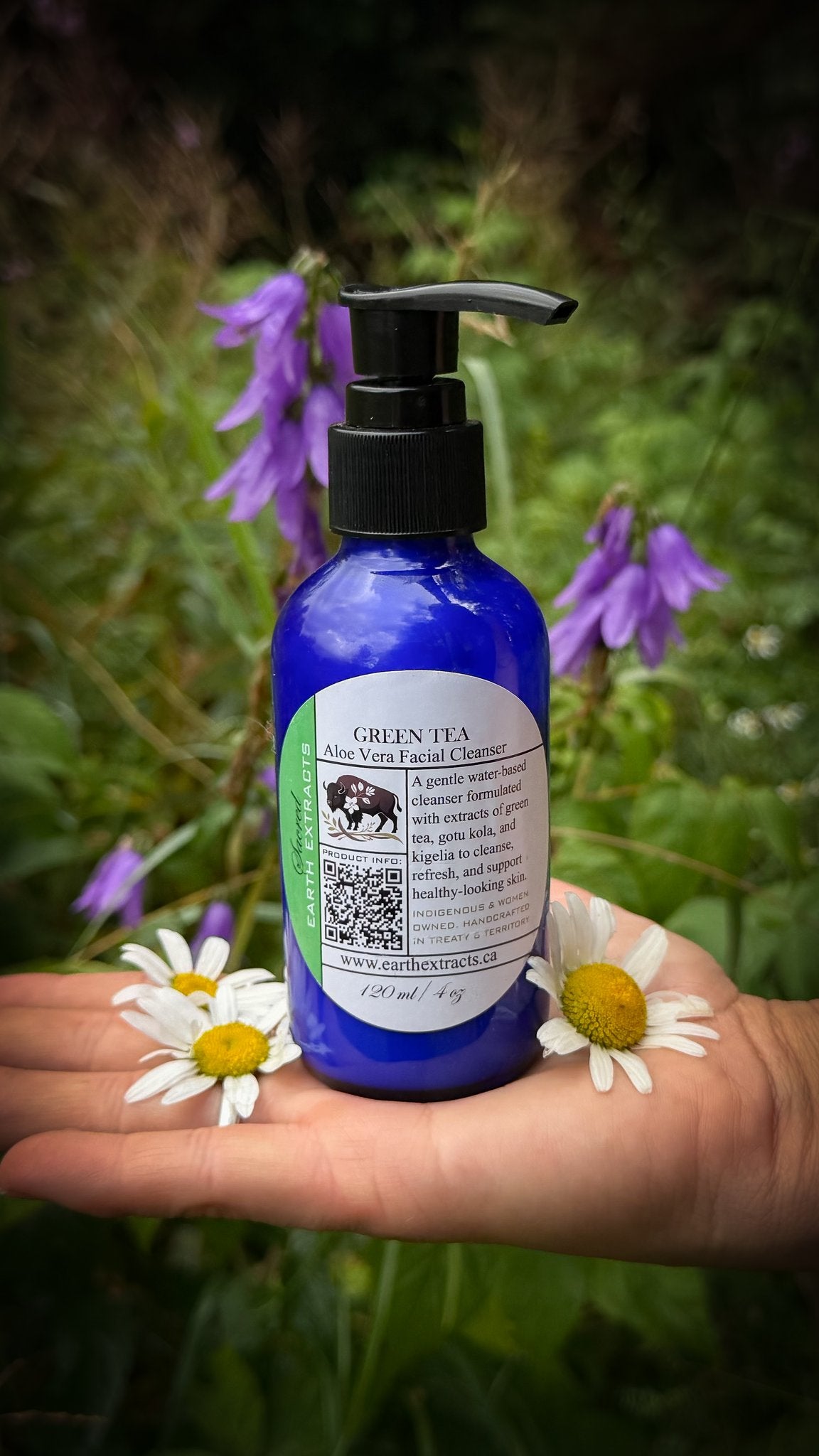 Green Tea Aloe Vera facial cleanser among purple bellflowers