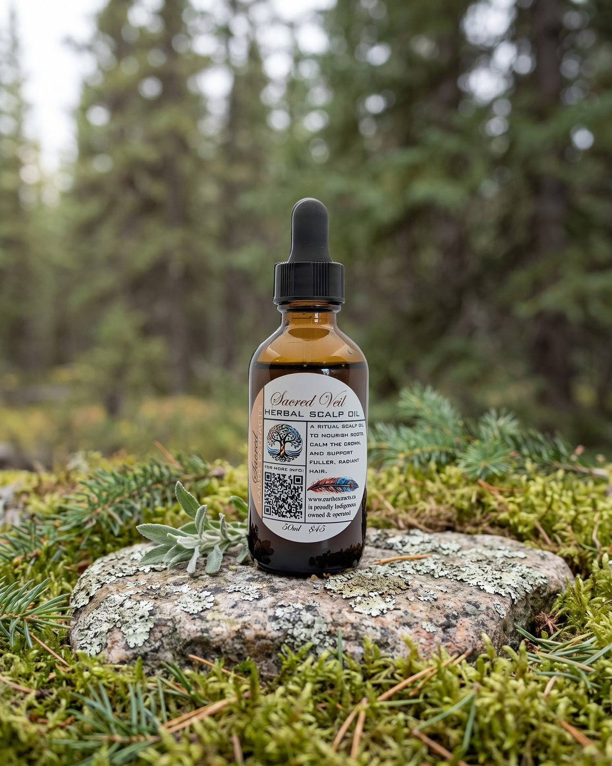 Sacred Veil Herbal Scalp Oil on a lichen-covered granite stone on a boreal forest floor
